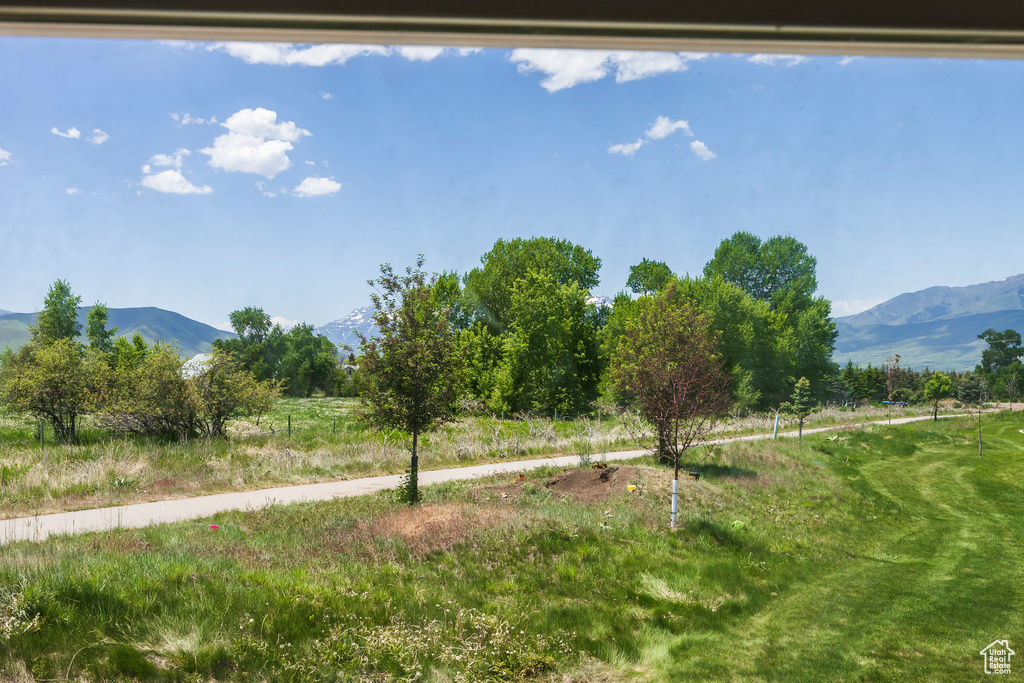 View of yard featuring a mountain view and a view of countryside