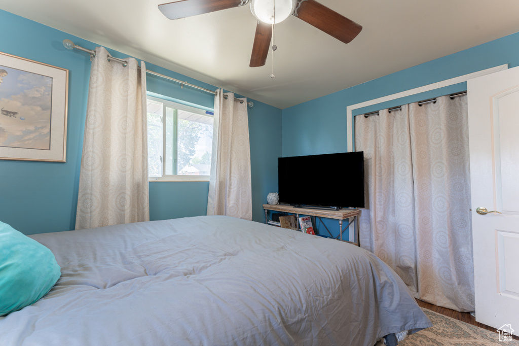 Bedroom featuring wood finished floors and ceiling fan