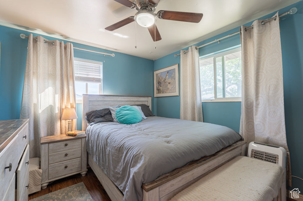 Bedroom featuring dark wood finished floors and ceiling fan