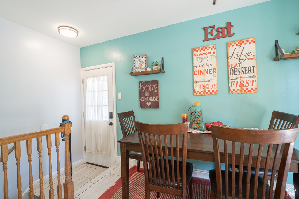 Dining room with wood tiled floors and baseboards