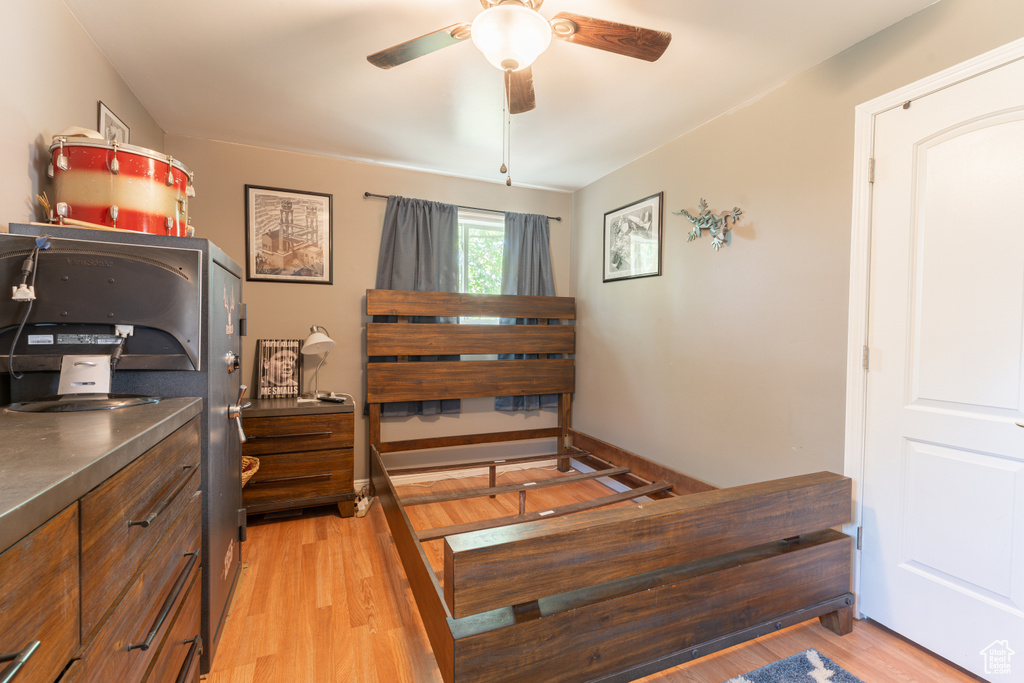 Bedroom featuring light wood-style floors and a ceiling fan
