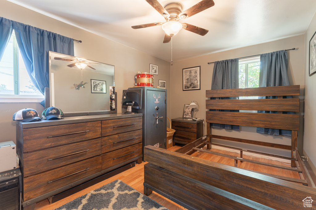 Bedroom with wood finished floors and a ceiling fan