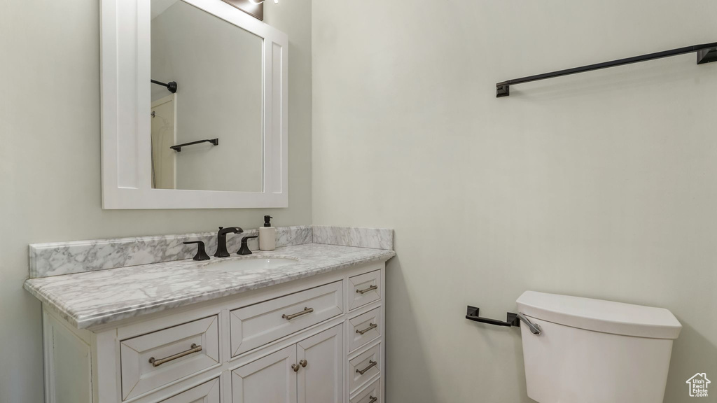 Bathroom featuring toilet and vanity