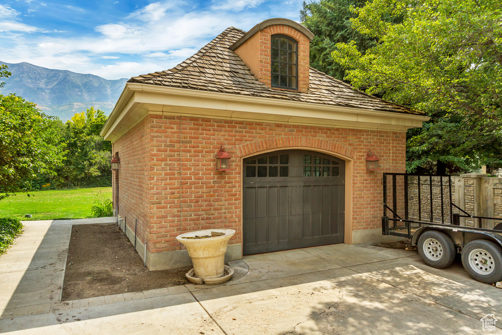 Garage featuring a mountain view