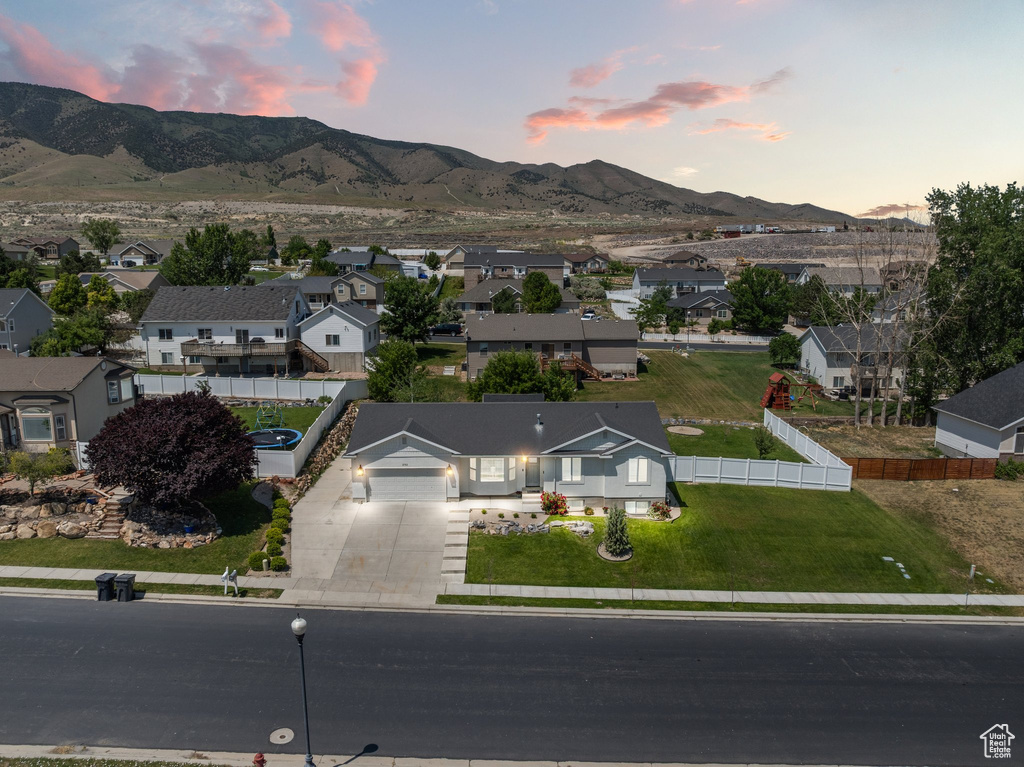 Aerial view at dusk of a residential view and a mountain view