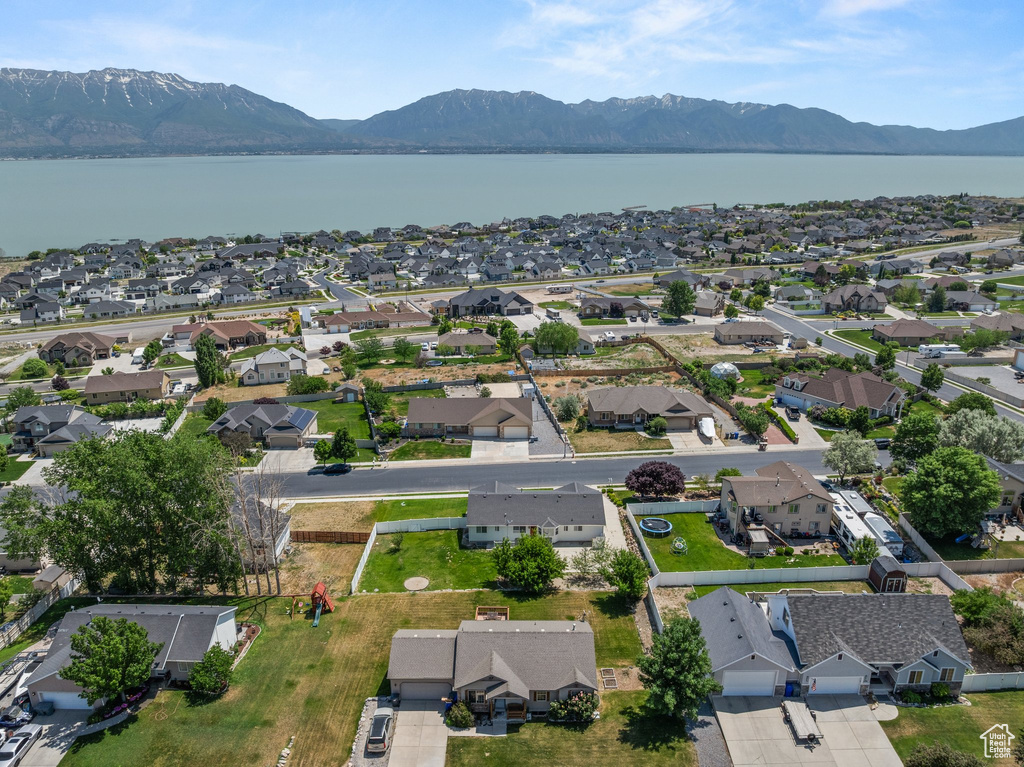 Aerial perspective of suburban area with a water and mountain view