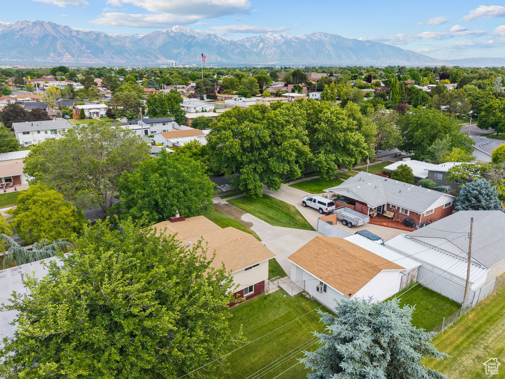 Aerial perspective of suburban area with a mountainous background