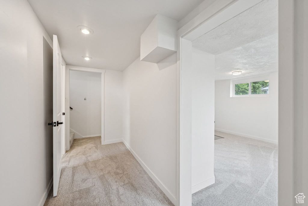 Corridor featuring carpet floors, recessed lighting, and baseboards