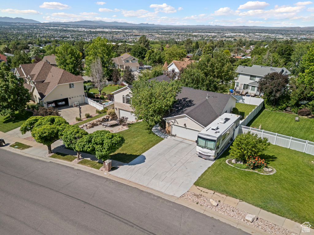 Aerial view of residential area featuring a mountain backdrop