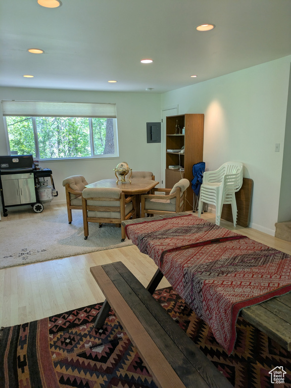 Bedroom with wood finished floors, recessed lighting, and baseboards