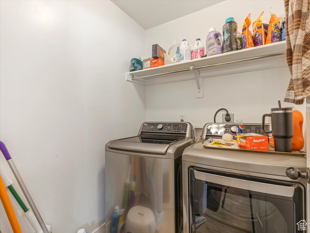 Washroom featuring washer and clothes dryer