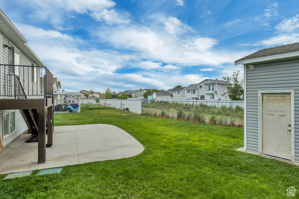 View of yard with a residential view and a patio