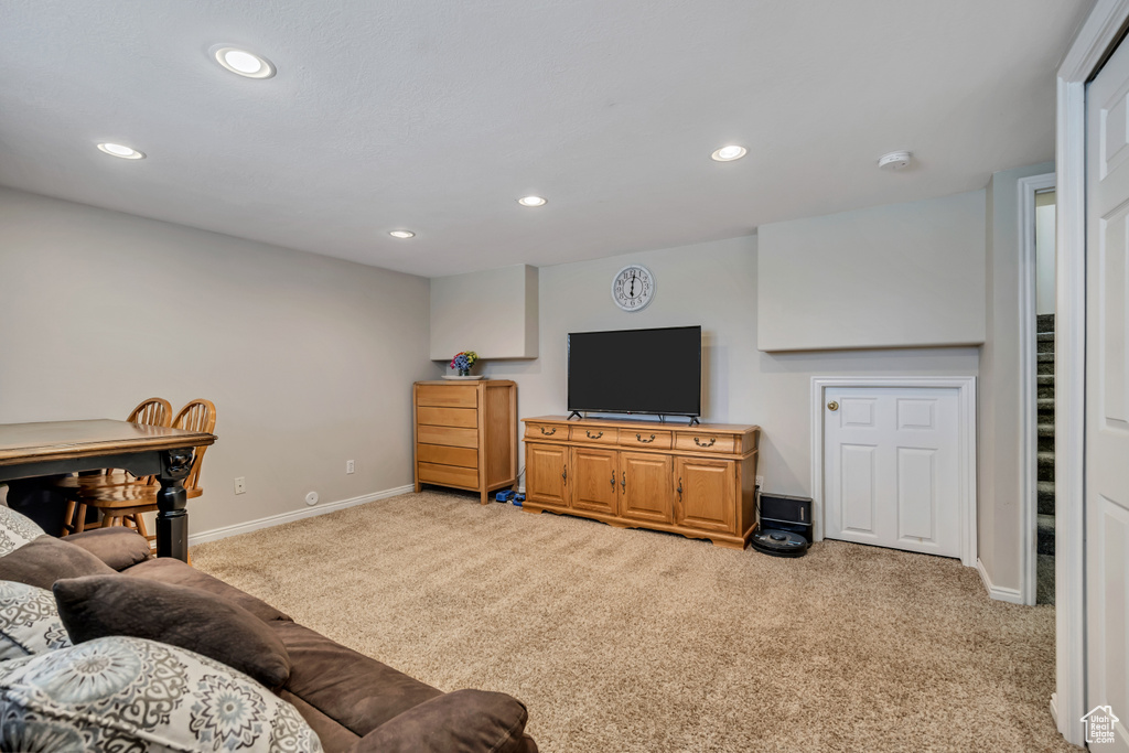 Living room with carpet, baseboards, and recessed lighting