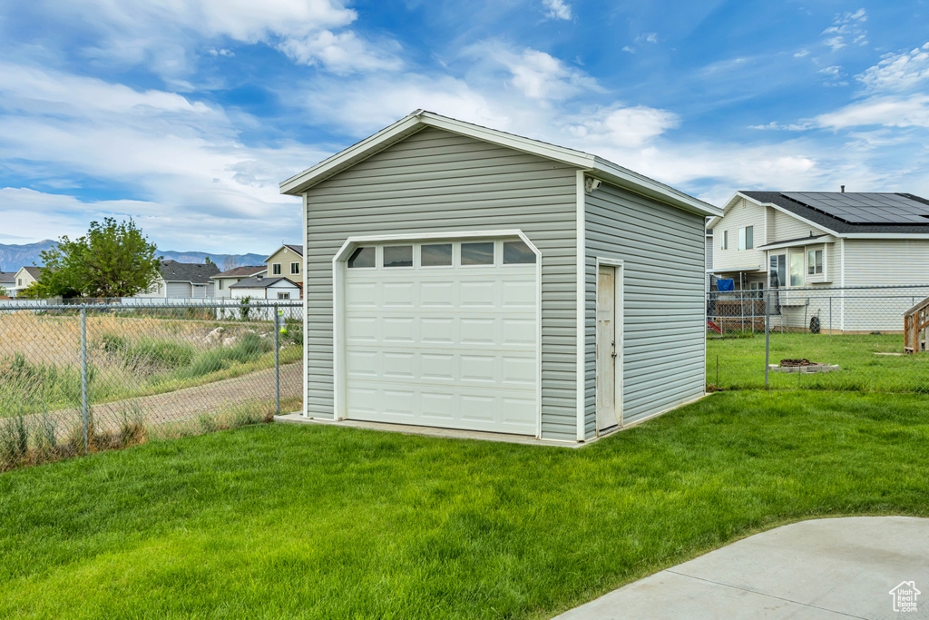 Detached garage with a mountain view