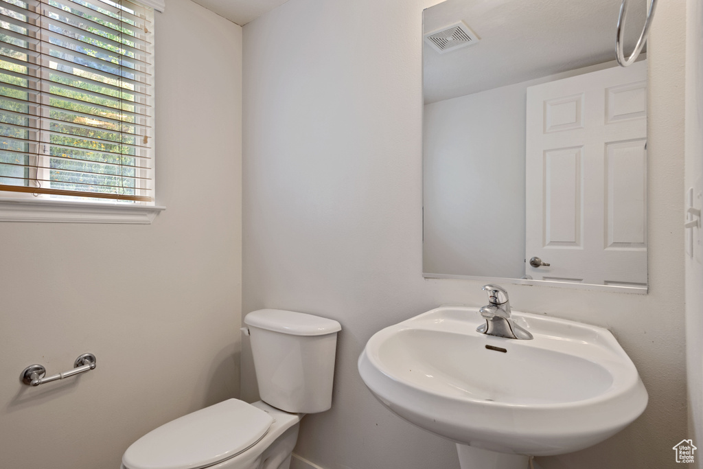 Bathroom featuring a sink and toilet