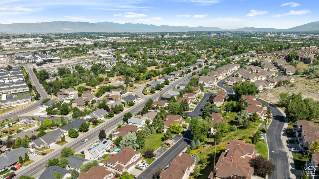 Aerial overview of property\'s location with a mountainous background and nearby suburban area