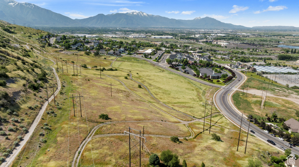 View of property location featuring a mountainous background and nearby suburban area