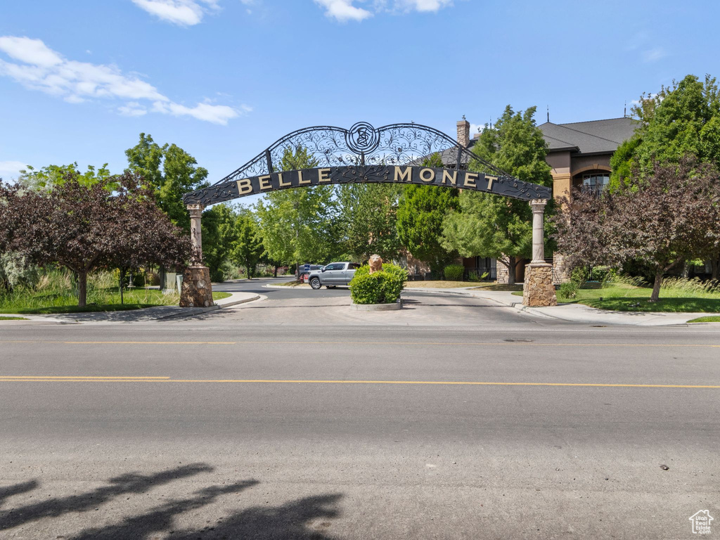 View of asphalt street featuring curbs and sidewalks