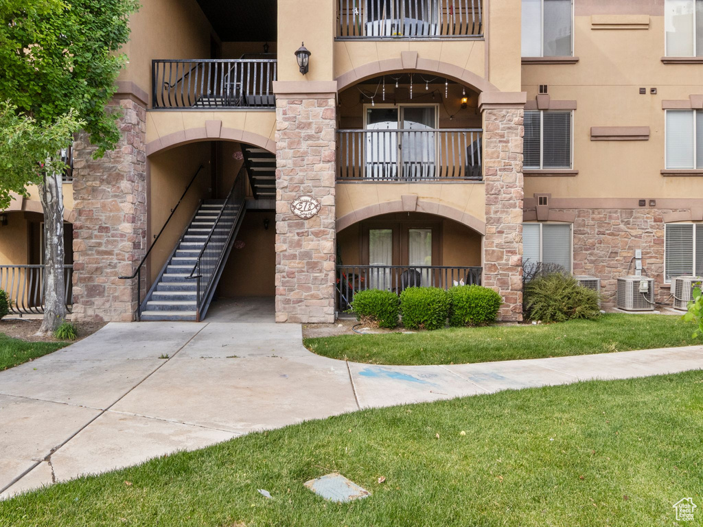 View of property with central AC unit