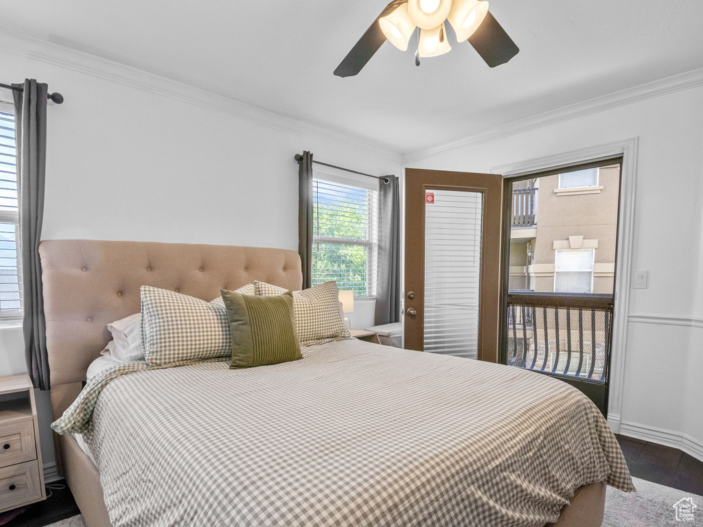 Bedroom featuring crown molding, a ceiling fan, baseboards, and dark wood-style flooring