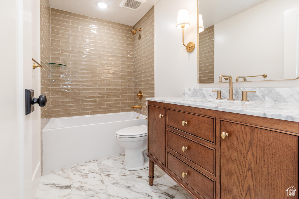 Full bathroom with vanity, toilet, shower / tub combination, and marble finish floors
