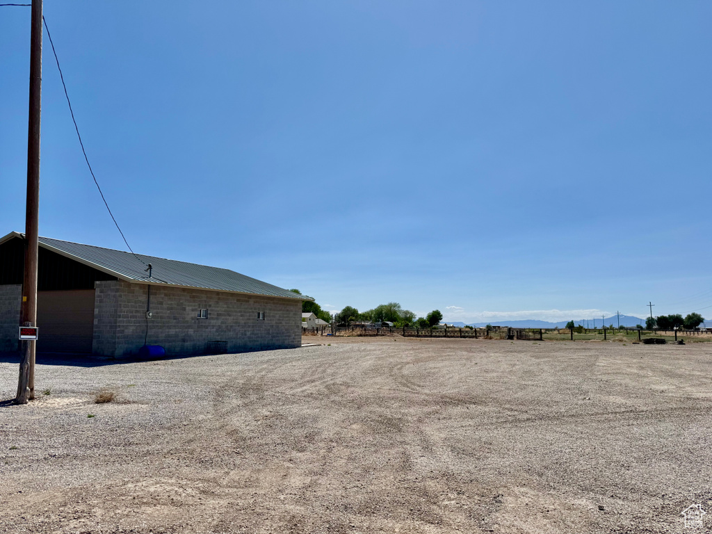 View of yard with a mountain view and an outbuilding