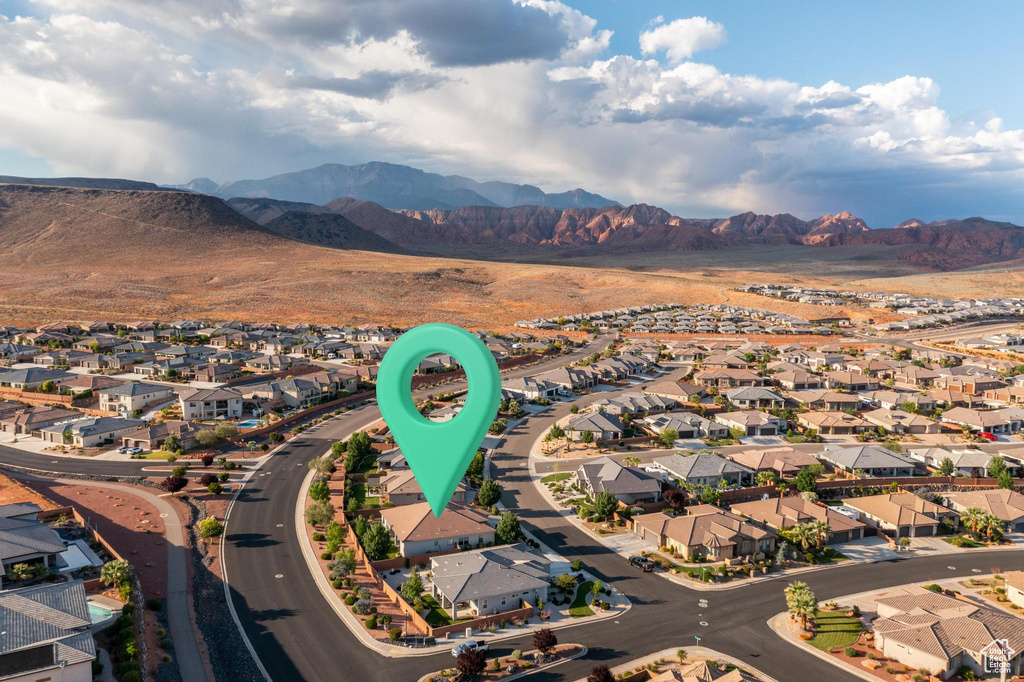 Aerial view of residential area featuring a mountain backdrop