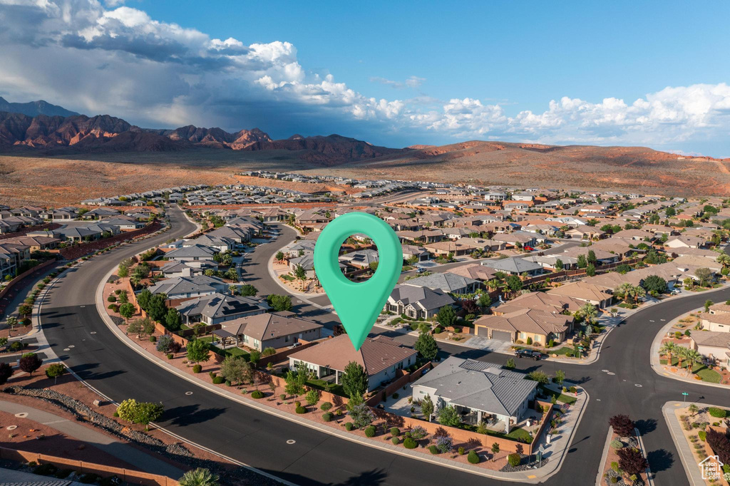 Aerial view of residential area featuring a mountain backdrop