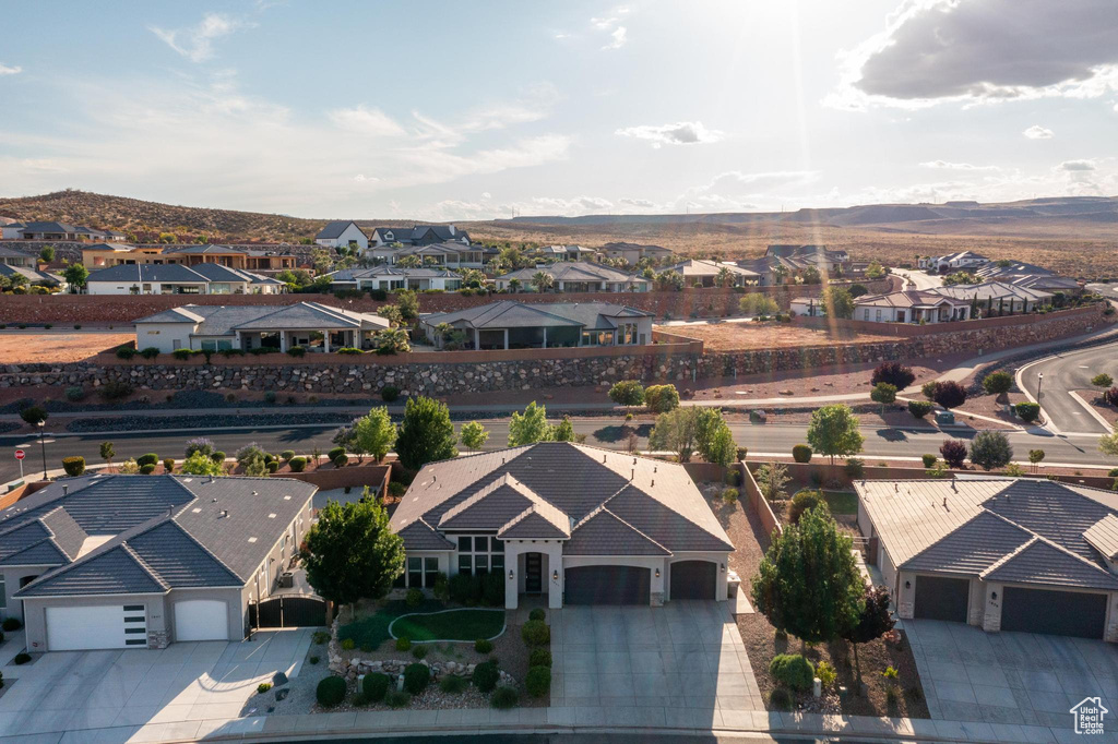 Aerial view of residential area featuring a mountain backdrop