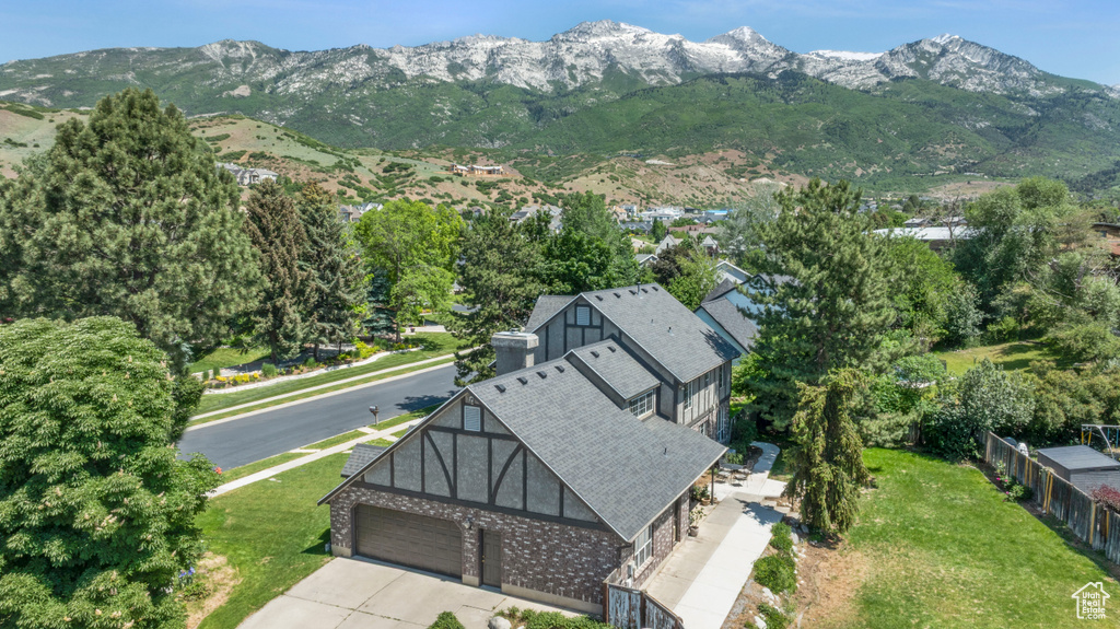 View of subject property featuring mountains