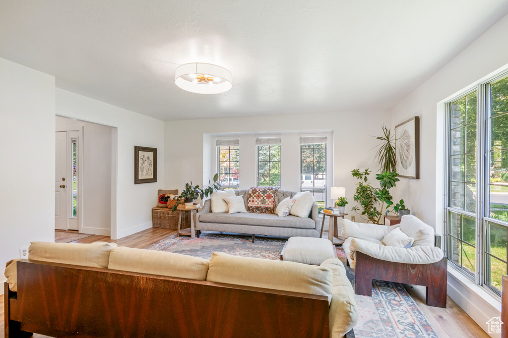 Living area with light wood-style floors and baseboards