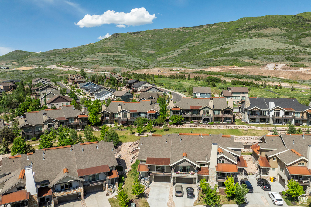 Aerial perspective of suburban area featuring a mountainous background