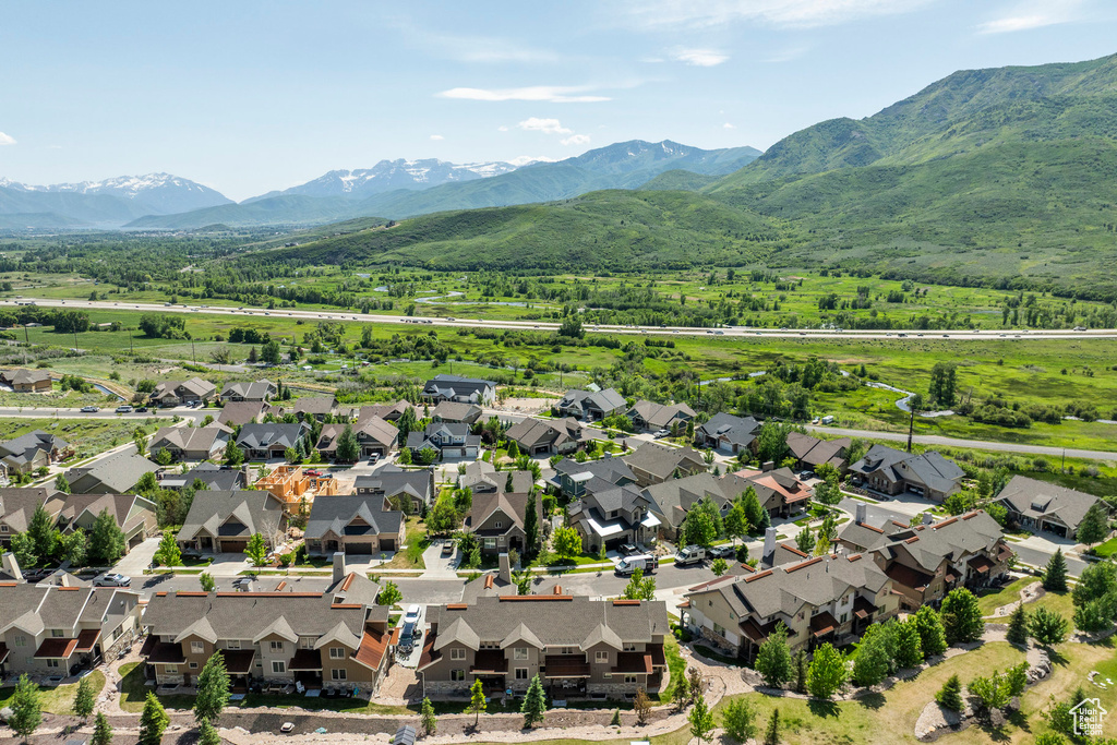 Aerial perspective of suburban area featuring a mountain backdrop
