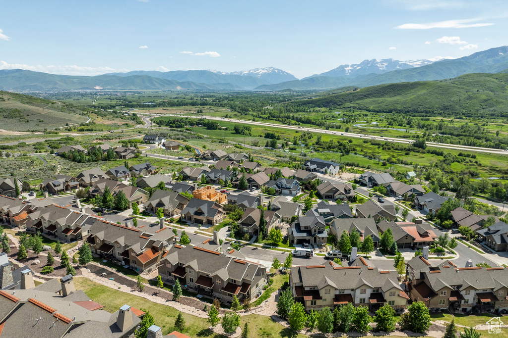Aerial perspective of suburban area with a mountain backdrop