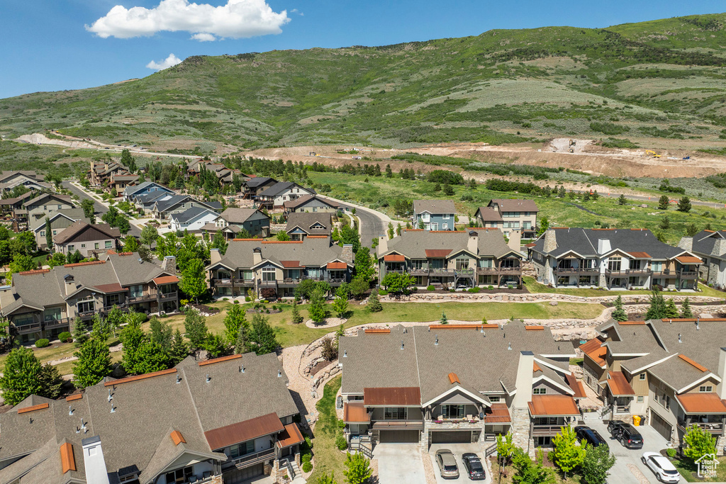 Aerial view of residential area featuring a mountainous background