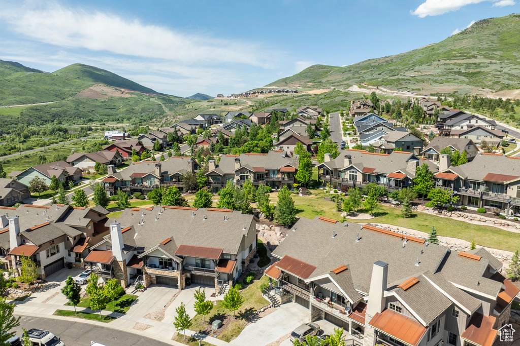Aerial perspective of suburban area with a mountainous background