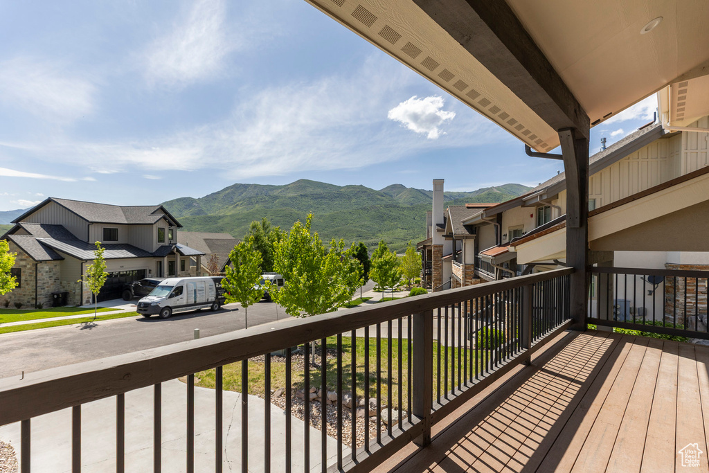 Balcony featuring a mountain view and a residential view