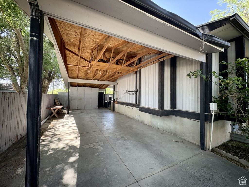 View of property exterior featuring an outbuilding
