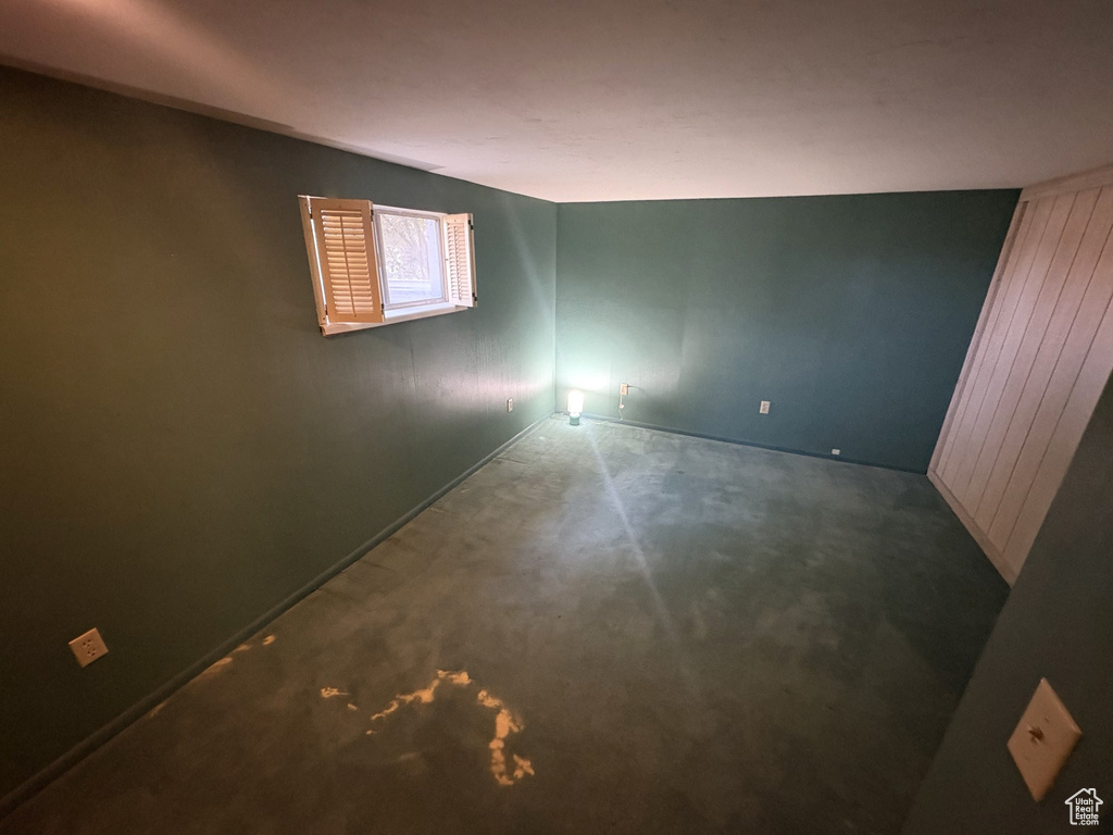 Unfurnished room with baseboards and carpet flooring