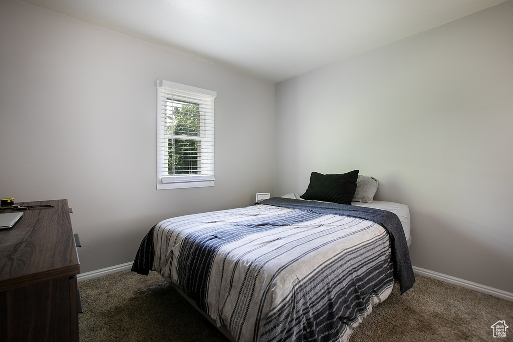 Carpeted bedroom with baseboards