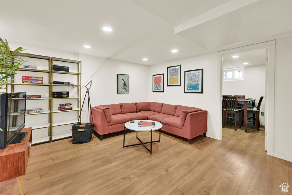 Living room featuring light wood-style flooring and recessed lighting