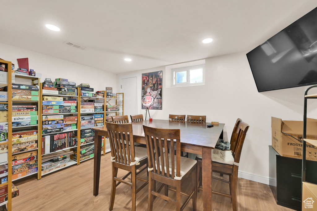 Dining room featuring wood finished floors, recessed lighting, and baseboards