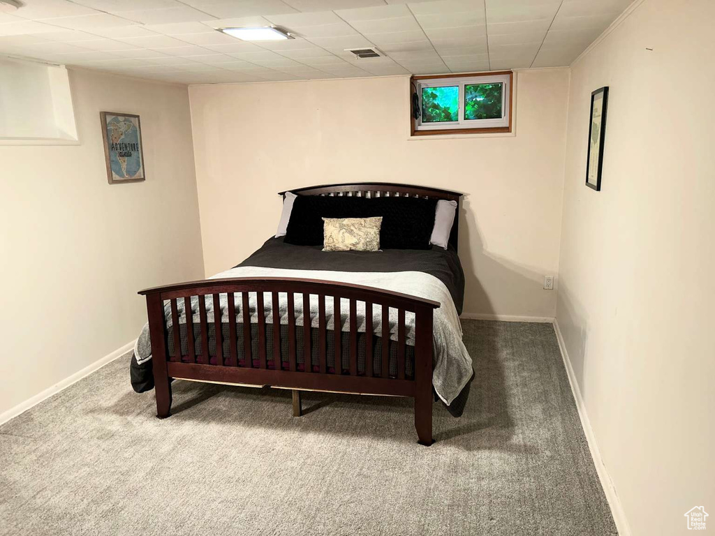 Carpeted bedroom featuring baseboards