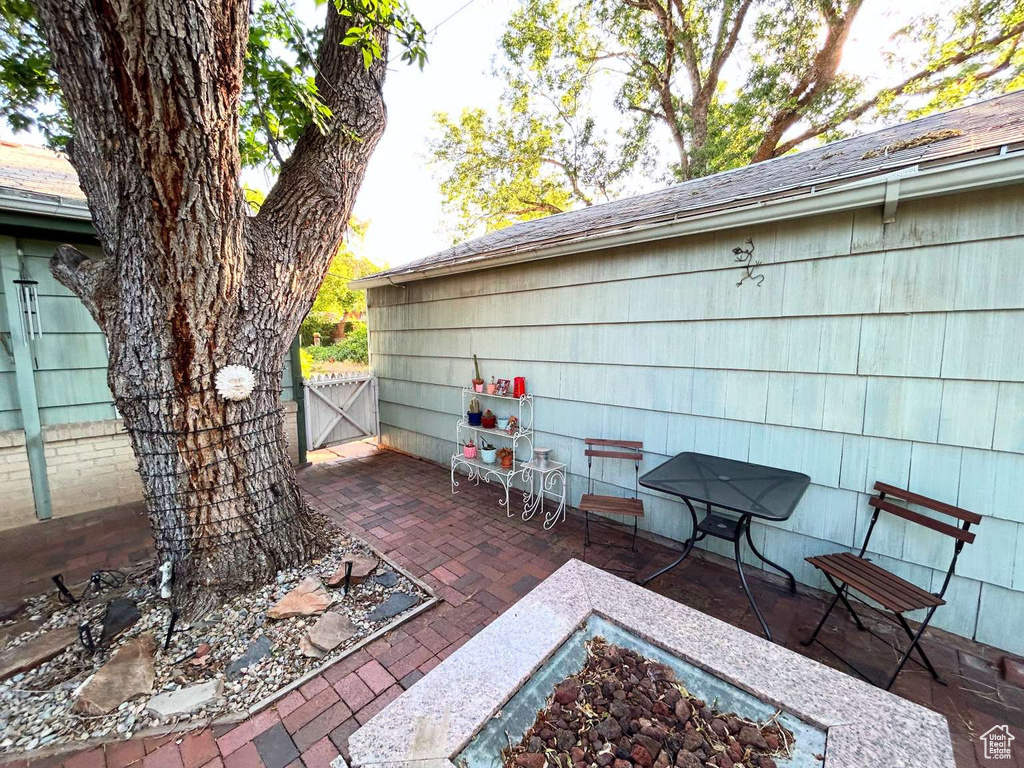 View of patio with a gate