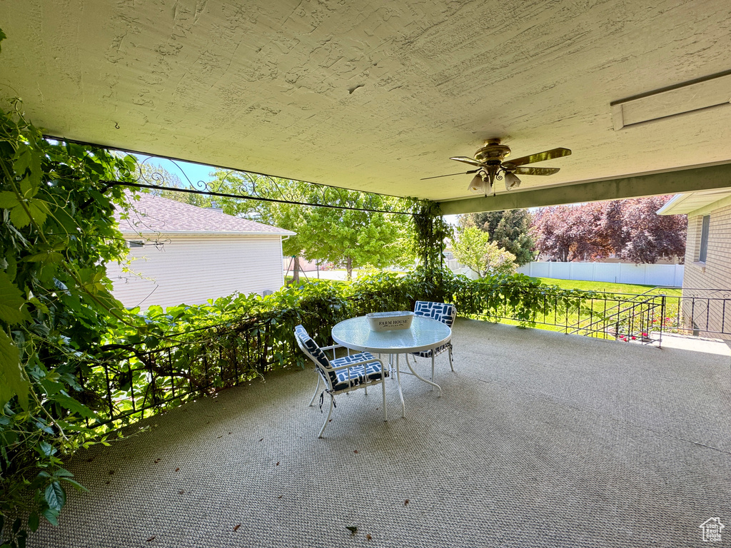 View of patio with ceiling fan