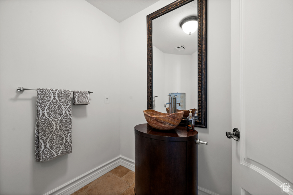 Bathroom featuring baseboards and vanity