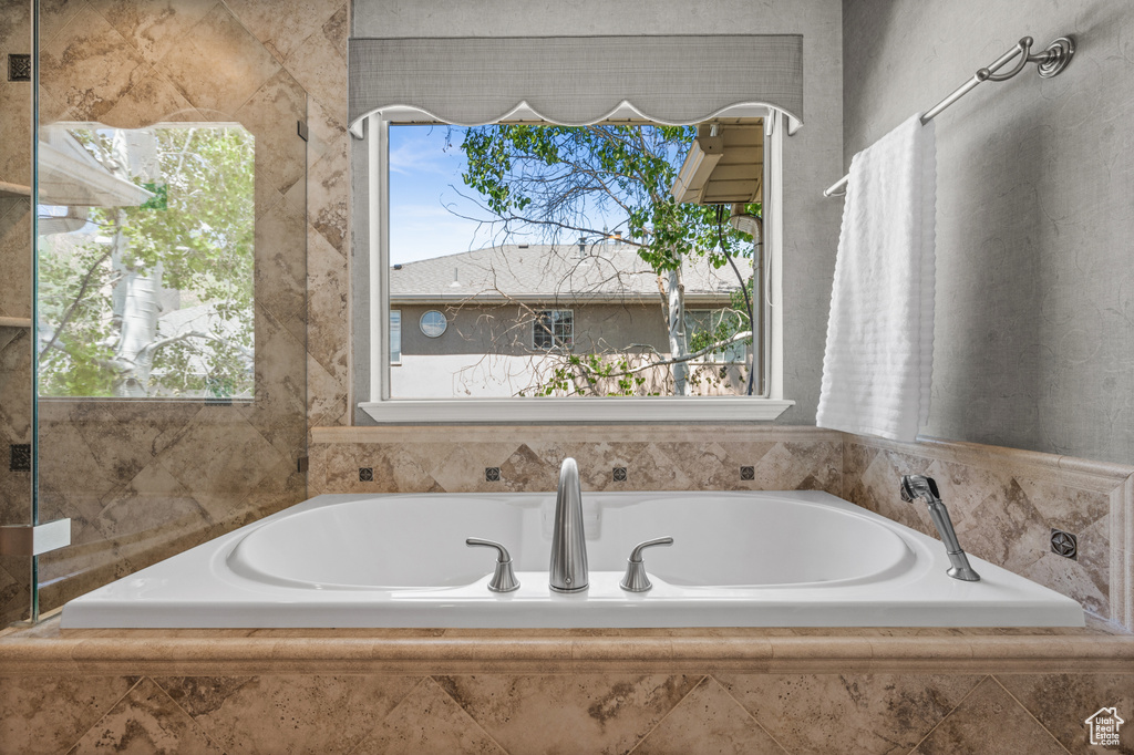 Full bathroom with a bath