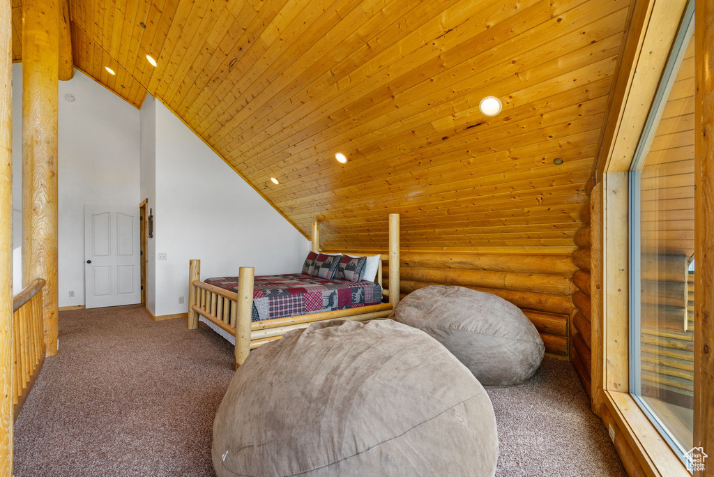 Bedroom featuring carpet floors, log walls, wood ceiling, recessed lighting, and baseboards