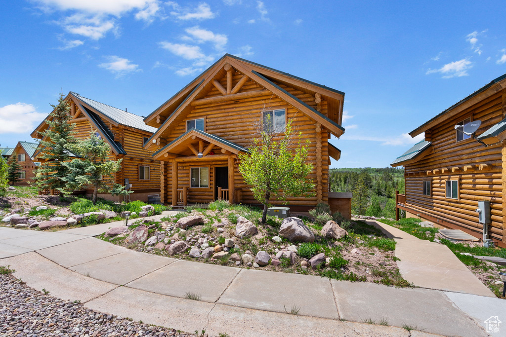Log home with log siding