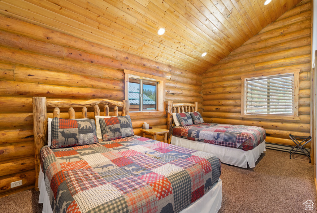 Carpeted bedroom featuring rustic walls, wooden ceiling, and high vaulted ceiling